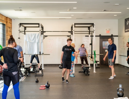 peoples on group training in anchor gym